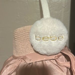 Bebe white furry with gold lettering on each muff! Really warm!!!!!